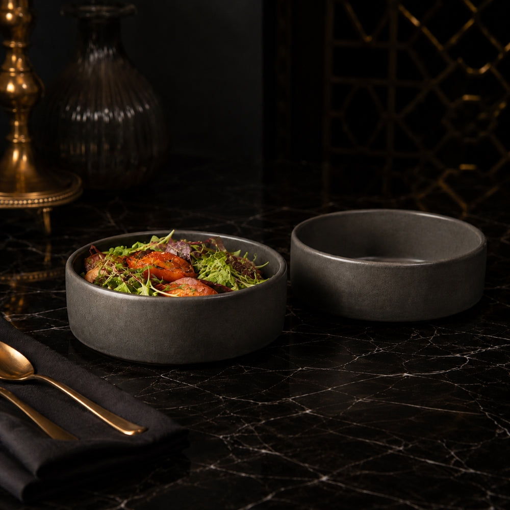 Stack Salad Bowl 6-inch in Gray, a handcrafted matte-finish stoneware bowl served with salad in a marble tabletop