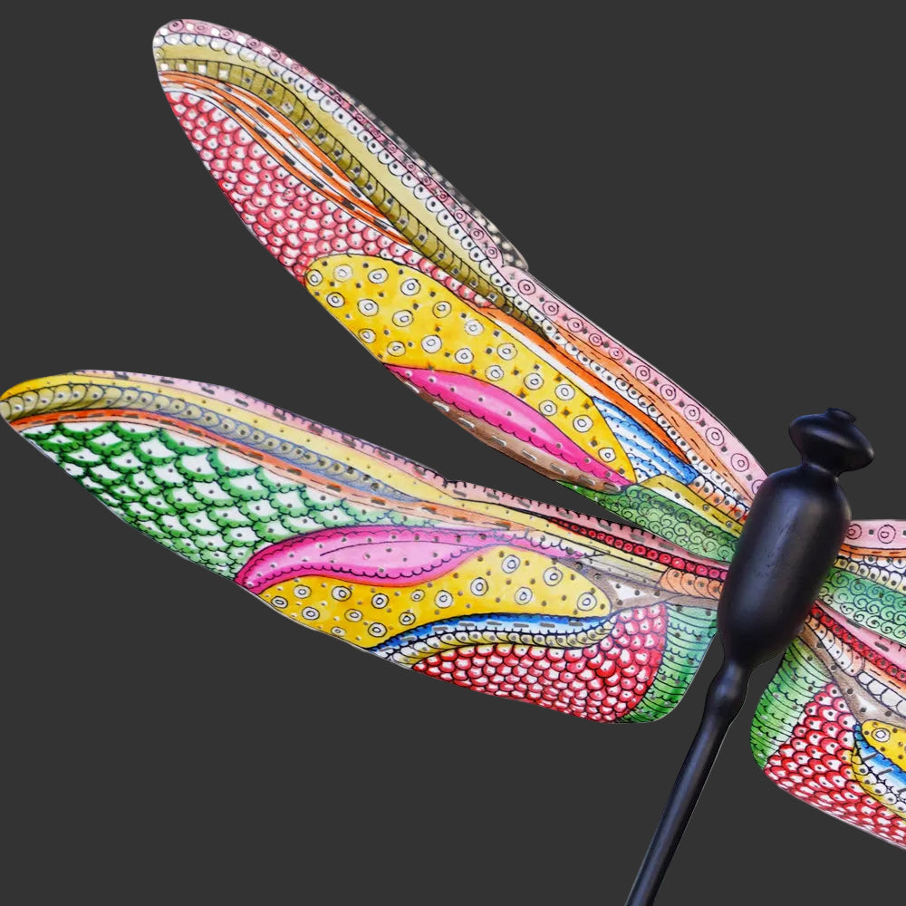 Close-up angled view of the Tholu Dragonfly Wall Décor's body and wings, highlighting its hand-painted craftsmanship against a white background.