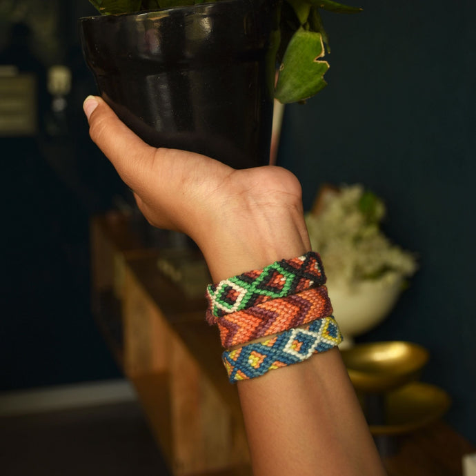 LuvAndTheBand Rakhi Handmade Colorful Braided Rakhi with Golden Button. Available in 6, 8, 10, 12 threads rakhi. Pattern Available Bird Mat Fish ZigZag Heart Slant Pride Multicolor.
